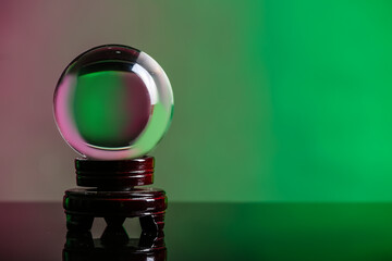Crystal ball of fortune teller on table