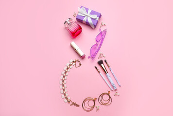 Figure 8 made of cosmetics and accessories on color background. International Women's Day celebration
