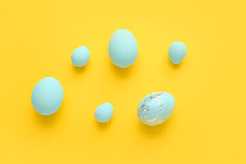 Beautiful Easter eggs on color background