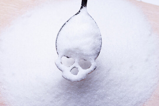 Salt or sugar on a teaspoon