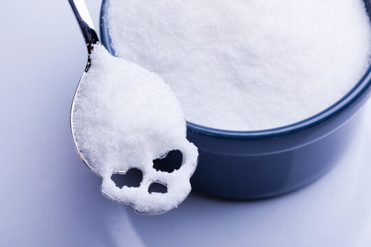 Salt or sugar on a teaspoon