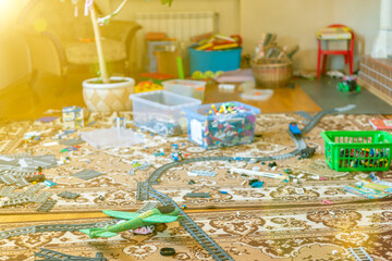 Games floor for preschoolers kindergarten. interior children's room. mess in the room. mess in the children's room, scattered toys, boxes on the floor. toned