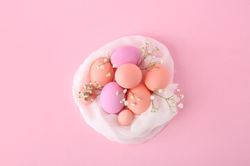 Composition with beautiful Easter eggs on color background