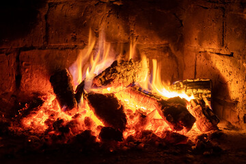 A fire burns in a fireplace, Fire to keep warm