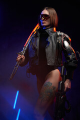 Fantasy portrait of a attractive female soldier with short haircut holding a futuristic sword on her shoulder and gun. Dangerous woman in cyberpunk style going in dark background.