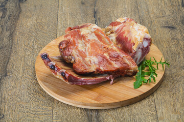 Smoked pork ribs over the wooden background