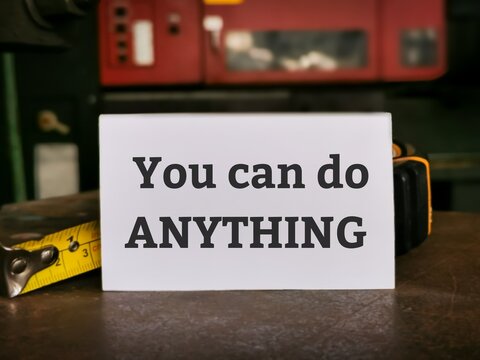 Phrase You can do ANYTHING written on white card. Motivational quote.