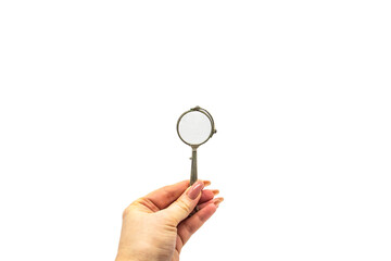 Hand hold an old vintage lorgnette from the middle of the nineteenth century on the white background