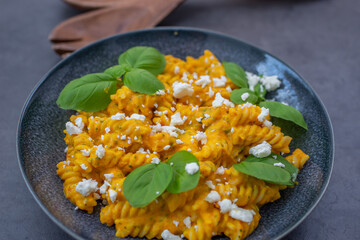 Creamy roasted pumpkin penne pasta on a table
