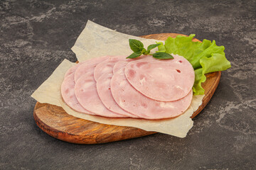 Slised ham snack over board