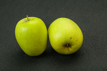 Two ripe green sweet apples