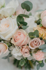 Wedding flowers, bridal bouquet close-up. Decoration of roses, peonies and ornamental plants, close-up, selective focus.