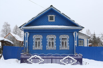 Vintage wooden rural house in Sudislavl town, Kostroma region, Russia. Building facade, ornamental...