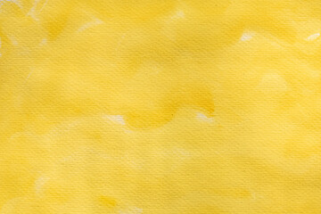 Abstract Yellow watercolor stain on background painted by hand