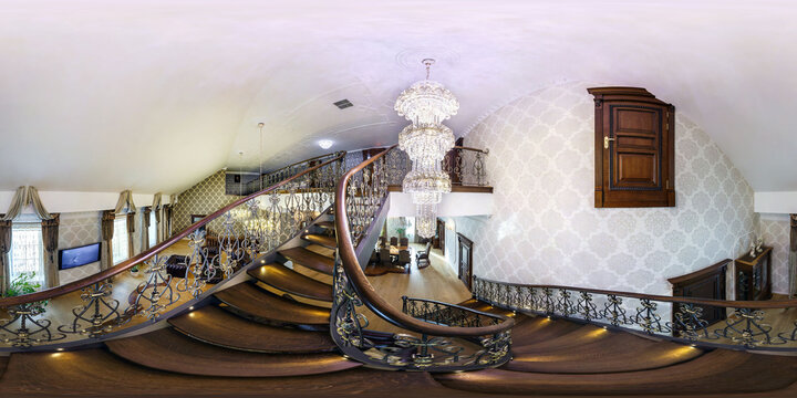 MINSK, BELARUS - May 2015: Full spherical seamless hdri panorama 360 in interior of room in luxury homestead house with spiral staircase and huge chandelier in equirectangular projection, VR content