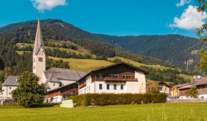 Fototapeta na wymiar Beautiful alpine summer view with a church at Uttendorf, Salzburg, Austria