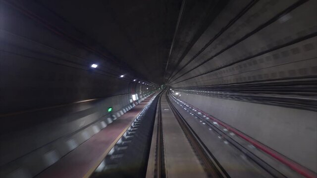 Time lapse automatic train driving in tunnel, subway journey view in dark tunnel fast speed 4k footage.