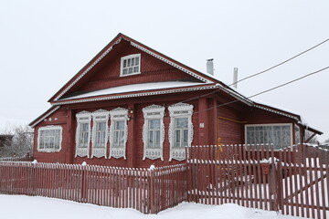 Vintage wooden rural house in Maydakovo village in Ivanovo region, Russia. Building facade;...