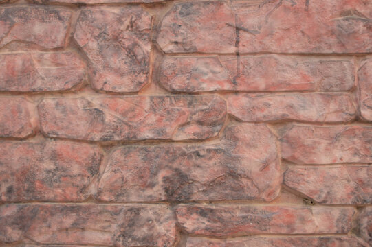 Texture Of Pale Pink Wall Relief With Stone Relief