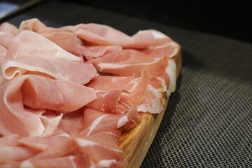 appetizer with wine and ham , cheese and traditional sausages