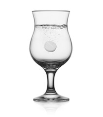 glass of clean water with aspirin pill. Isolated