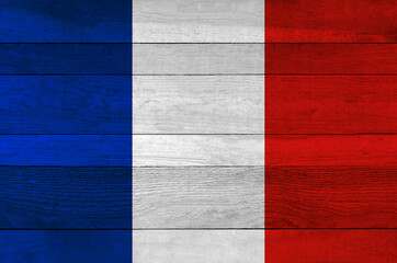 France national flag painted on a wooden plank background.