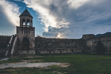beautiful sky over the ancient stone fortress wall and a guard tower