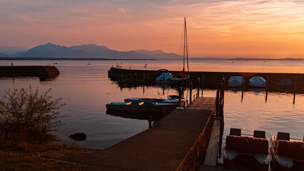 Fototapeta na wymiar Beautiful sunset with reflections at the famous Chiemsee, Chieming, Bavaria, Germany
