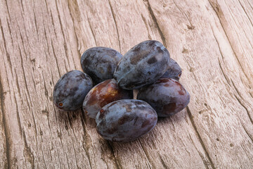 Purple sweet ripe plum heap