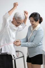 Obraz premium Old people measuring waist with tape measure,smiling asian senior woman raise hands feels happy satisfaction,proud of her weight loss as advised by doctor,success of diet,weight control,health care