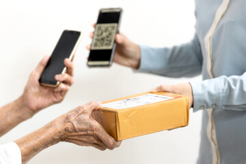 Female delivery worker deliver parcel box,old people receive ordered goods from online...