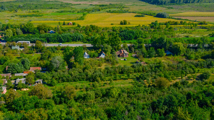 Above view over cottage settlement, forest, landscape