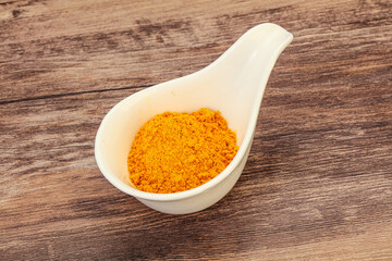 Tumeric powder in the bowl