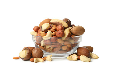 Glass bowl with different nuts isolated on white background
