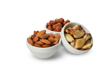 Bowls with different nuts isolated on white background