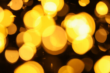 Abstract bright yellow bokeh background for holiday concepts