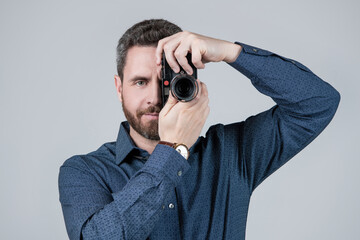 Photo click meets perfection. Camera man take photo grey background