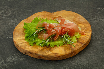 Sliced pork Jamon with rosemary