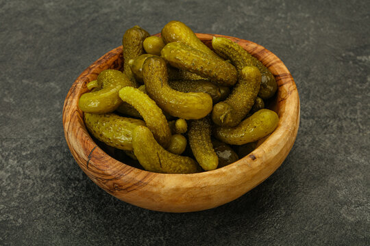 Pickled gherkin in the bowl