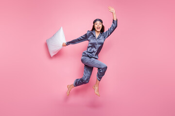 Full length body size photo of girl wearing pajama waving hand with pillow in morning late isolated...