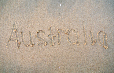Australia words written on beach sand. Australia inscription is written on a sand.
