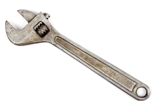 Old adjustable spanner isolated