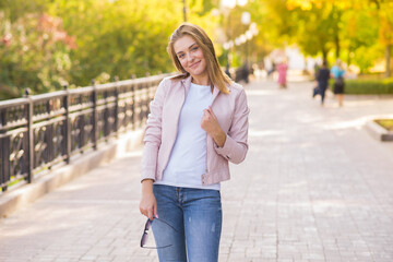 Portrait of a young happy and pretty blonde girl