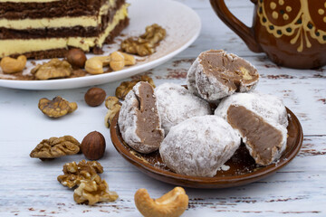 Chocolate truffles with walnuts, milk candy with walnuts, creamy cashew fudge, sweet dessert, layer cake, tiramisu, striped honey cake,