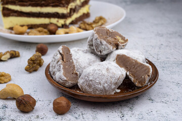 Chocolate truffles with walnuts, milk candy with walnuts, creamy cashew fudge, sweet dessert, layer cake, tiramisu, striped honey cake,