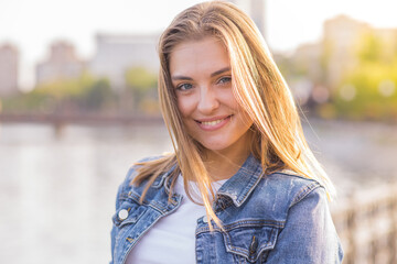 Portrait of a young happy and pretty blonde girl