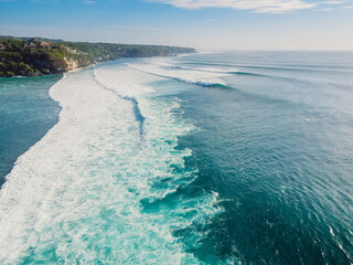 Aerial view of big waves and ocean coastline. Biggest waves in Bali