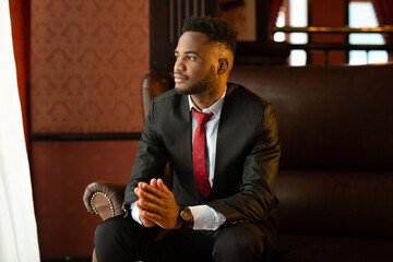 handsome young african man in suit 