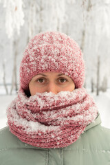 Portrait of a girl covered with snow