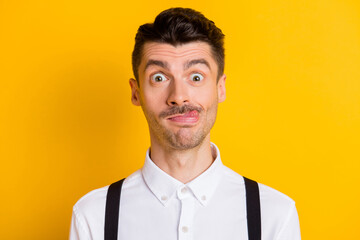 Photo portrait of young student fooling grimacing showing tongue silly idiot isolated on vibrant...